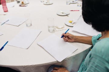 Adult business women start to writing idea on the white paper