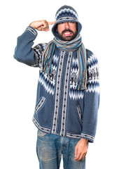 Man with winter clothes making crazy gesture