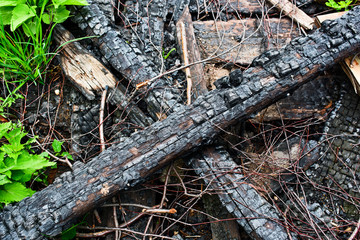 Cross of two burnt planks of a wooden building