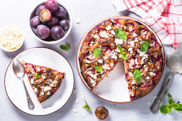 Cake with plums and almond flake.