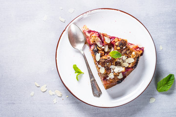 Cake with plums and almond flake.