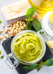 Pesto sauce in glass jar. 