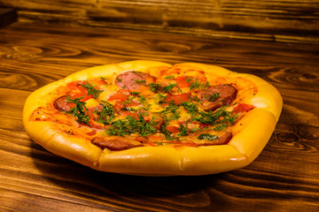 Fresh homemade pizza on a wooden table
