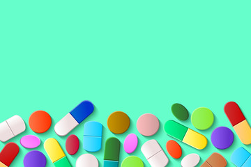 Colorful pills, tablets and capsules in the lower half on a light green background. Pharmaceutical medicine concept with place for text.