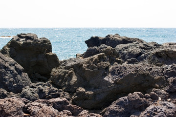 Fototapeta na wymiar Lava, volcanic lava on beach Sicily island 