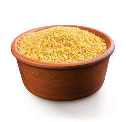 Fresh organic millet in bowl, Top view.