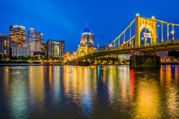 Fototapeta na wymiar The Roberto Clemente Bridge and Pittsburgh skyline at night, seen from Allegheny Landing, in Pittsburgh, Pennsylvania.
