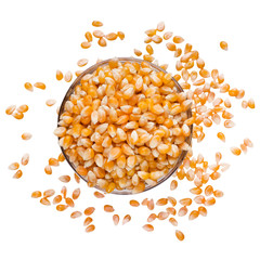 Unpopped popcorn in bowl on white background.