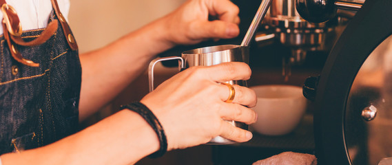 close up barista hand making a cup of coffee.