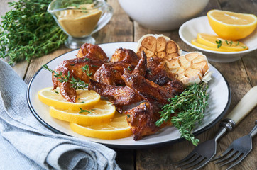 Grilled chicken wings with thyme and garlic       