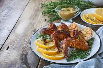 Grilled chicken wings with thyme and garlic       