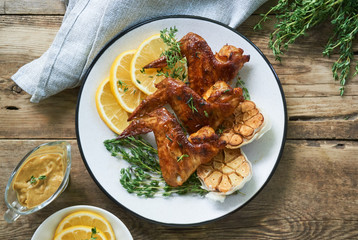 Grilled chicken wings with thyme and garlic       