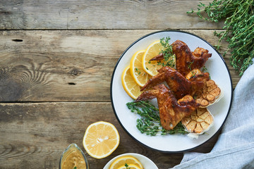 Grilled chicken wings with thyme and garlic       