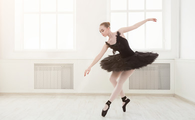Beautiful graceful ballerina in black swan dress © Prostock-studio