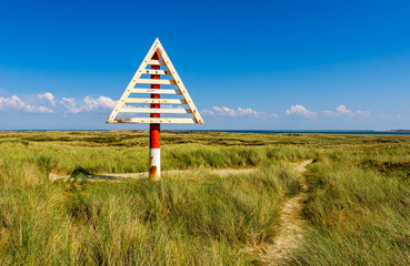 These Signs (German: Bake) on the Ellenbogen Beach mark the border between Germany and Denmark in the Wadden Sea. There are corresponding markings on the Danish mainland. 