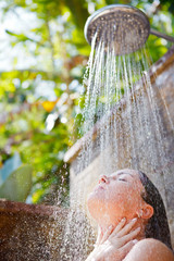 Naklejka premium women in tropic shower