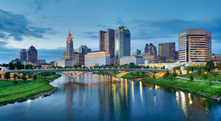 Evening Columbus Ohio skyline along the Scioto River at dusk