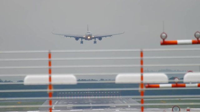 Airplane landing at wet weather