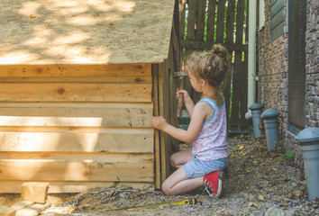 the child builds the booth for dogs