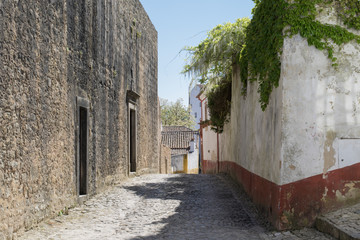 Empty historic streets inside the walled town of Obidos. Portugal