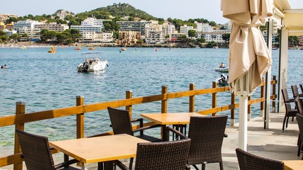 Tables and chairs beside the Mediterranean on the South side of the island.