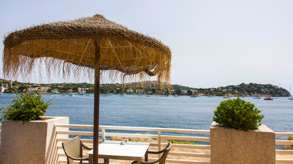 Table and chairs beside the Mediterranean on the South side of the island of Mallorca.