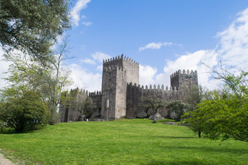 Obraz premium Open lawns in front of the medieval castle in Guimaraes, Portugal 