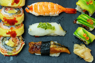 luxury japanese sushi set on black slate stone