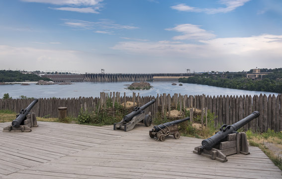 Four ancient cannon on the Khortitsa Island and hydroelectric power station in Ukraine