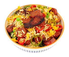 Bowl of egg fried rice with spicy chorizo salami and Chilli peppers background