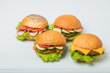 Craft beef burger on wooden table isolated on white background