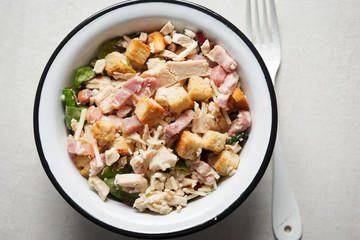 Chicken caesar salad with croutons and parmesan 