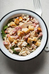Chicken caesar salad with croutons and parmesan 