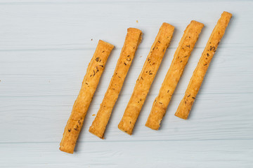 salted crispy cookies with sesame seeds on white background