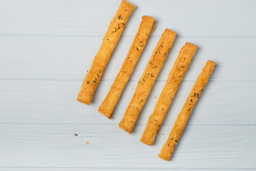 salted crispy cookies with sesame seeds on white background