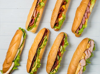 Fresh sub sandwich on white and wheat hoagies.