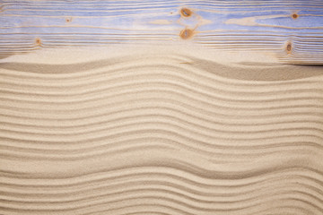Fototapeta na wymiar Beach sand and wooden plank