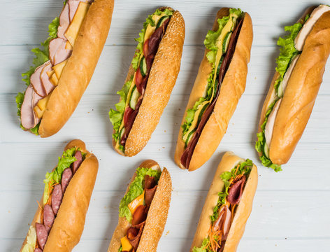 Fresh sub sandwich on white and wheat hoagies.