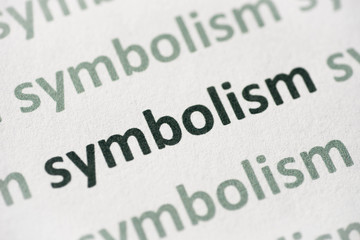 word symbolism printed on paper macro