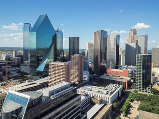 Aerial view financial district in Downtown Dallas, Texas, USA. Modern skyscrapers under summer cloud blue sky. Metropolis and cityscape background