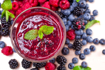 berry smoothies in a glass on a table
