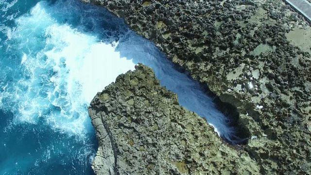 Waves that hit the rocks in indornesia 4K