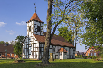 Fototapeta na wymiar Little church in the idyllic village Grunow, Brandenburg.