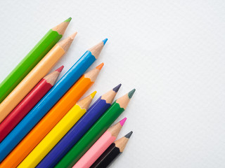Closeup color pencils isolated on white paper background. Education, Back to school Concept.
