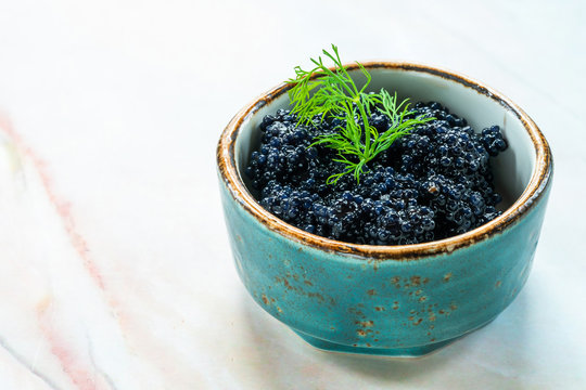 Black lumpfish caviar in a small pot