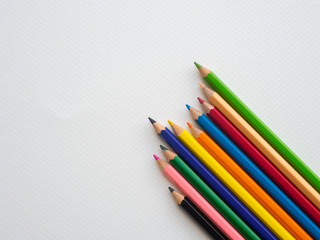 Closeup color pencils isolated on white paper background. Education, Back to school Concept.
