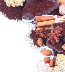Chocolate, cocoa, nuts, cinnamon on a white background