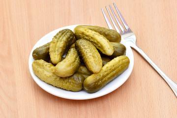 Pickled cucumbers in a plate.