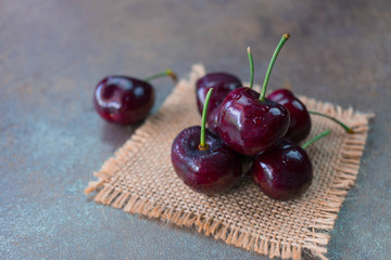 Fresh organic cherries on burlap