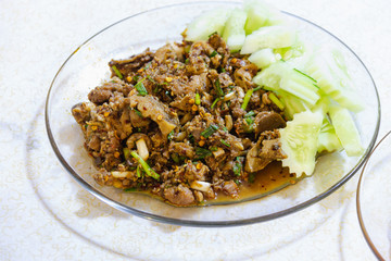 spicy pork food in glass dish of thai style